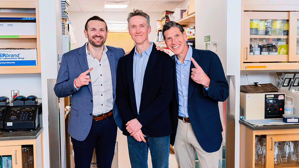 UCSF Brain Tumor Center principal investigator Joseph Costello, PhD, stands in between Pete and Mark Meadows. Photo by Marco Sanchez. 