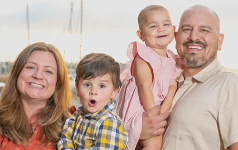 Joe Quirarte (right) with his wife (left) and two children.