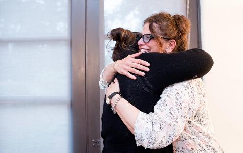 UCSF social worker Rosemary Rossi, MSW, hugs a caregiver at the annual Caregiver Retreat held by UCSF Neuro-Oncology Gordon Murray Caregiver Program