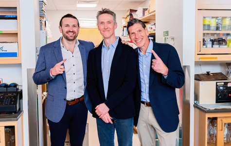 UCSF Brain Tumor Center principal investigator Joseph Costello, PhD, stands in between Pete and Mark Meadows. Photo by Marco Sanchez. 